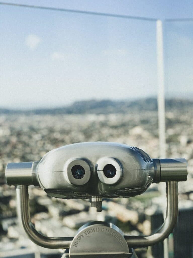 blue and gray binoculars on top of the building